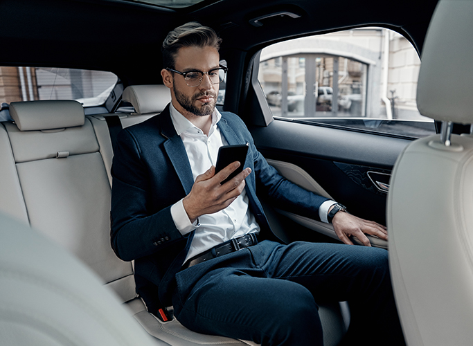 man-in-car-phone-business-chauffeur