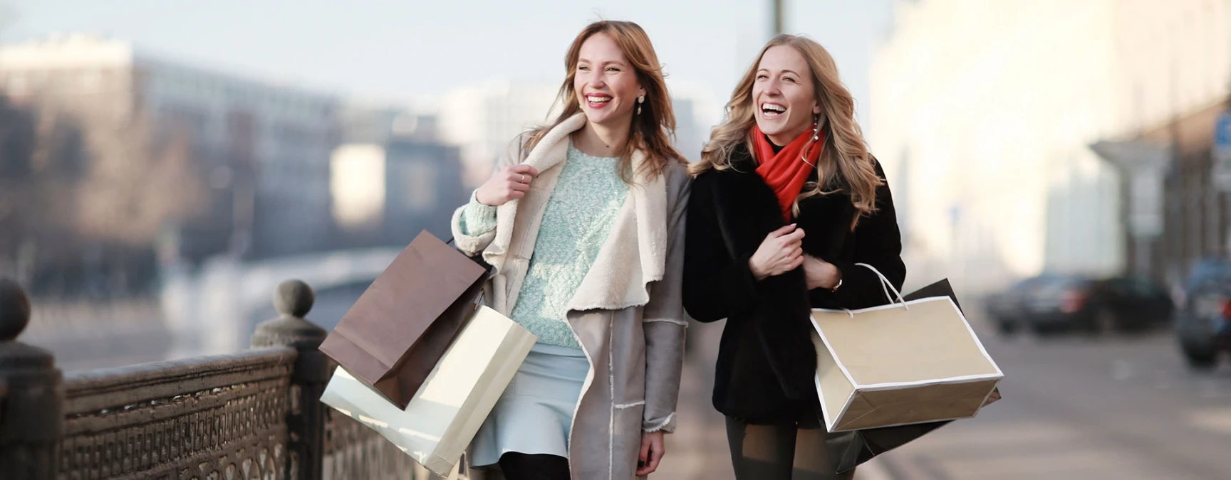 chauffeur opening door to women shopper